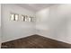 Dining area with wood floors and natural light from multiple windows at 3434 E Baseline Rd # 216, Phoenix, AZ 85042