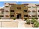 Exterior building view featuring a stairway entrance with patios and awnings at 3434 E Baseline Rd # 216, Phoenix, AZ 85042