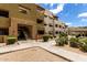 Exterior building view featuring a stairway entrance with patios and awnings at 3434 E Baseline Rd # 216, Phoenix, AZ 85042
