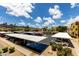 A well-maintained community parking area offers covered parking and neatly kept landscaping for a polished look at 3434 E Baseline Rd # 216, Phoenix, AZ 85042