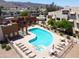 Community swimming pool and hot tub with lounge chairs and tables are inviting and refreshing at 3434 E Baseline Rd # 216, Phoenix, AZ 85042
