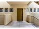 Entryway to unit 216 with security door and view of the outside neighborhood at 3434 E Baseline Rd # 216, Phoenix, AZ 85042