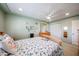 Bedroom featuring soft green walls, light wood furniture, closet at 3608 W Villa Rita Dr, Glendale, AZ 85308