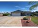Charming single-story home with two-car garage, and a well-manicured front lawn and landscaping at 3608 W Villa Rita Dr, Glendale, AZ 85308