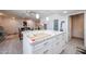 Kitchen island view connecting seamlessly to the dining and living spaces for an inclusive feel at 3608 W Villa Rita Dr, Glendale, AZ 85308