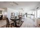Bright kitchen with white cabinets, stainless appliances, breakfast bar, and adjacent dining area at 3608 W Villa Rita Dr, Glendale, AZ 85308