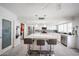 Bright kitchen with a large island, modern appliances, and adjacent laundry room at 3608 W Villa Rita Dr, Glendale, AZ 85308