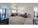 Spacious living room with plush carpeting, lots of seating, and abundant natural light at 3608 W Villa Rita Dr, Glendale, AZ 85308