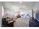 Open-concept living room with plush carpeting, a ceiling fan, and lots of natural light at 3608 W Villa Rita Dr, Glendale, AZ 85308