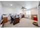 Spacious office with natural light, ceiling fan, and room for multiple desks and storage at 3608 W Villa Rita Dr, Glendale, AZ 85308