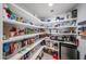 Walk-in pantry with abundant shelving, fully stocked with groceries and household goods at 3608 W Villa Rita Dr, Glendale, AZ 85308
