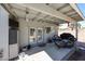 Covered patio with ample seating space, offering a comfortable outdoor living area, with access to the yard at 3608 W Villa Rita Dr, Glendale, AZ 85308