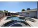 Inviting backyard pool and spa area surrounded by lush landscaping, offering a serene retreat for relaxation at 3608 W Villa Rita Dr, Glendale, AZ 85308