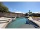 Sparkling pool and hot tub nestled in a well-maintained backyard with mature landscaping and a privacy fence at 3608 W Villa Rita Dr, Glendale, AZ 85308