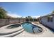 Backyard pool and spa surrounded by a patio and landscaping, creating a private outdoor oasis at 3608 W Villa Rita Dr, Glendale, AZ 85308