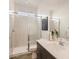 Modern bathroom with glass-enclosed shower, sleek vanity, and contemporary fixtures at 3858 E Kenley Ln, San Tan Valley, AZ 85143