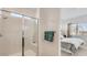 Bright bathroom with a glass shower enclosure, complemented by soothing colors and towels at 3858 E Kenley Ln, San Tan Valley, AZ 85143