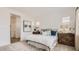 Bright bedroom featuring neutral decor, a cozy bed, and ample natural light at 3858 E Kenley Ln, San Tan Valley, AZ 85143