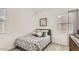 Comfortable bedroom with patterned bedding, natural light, and neutral decor at 3858 E Kenley Ln, San Tan Valley, AZ 85143