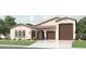Charming single-story home featuring a tile roof, a three-car garage, and a well-manicured front lawn at 3858 E Kenley Ln, San Tan Valley, AZ 85143