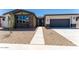 Charming single-story home featuring stone accents, a two-car garage, and desert landscaping at 39640 N Kaden Ln, San Tan Valley, AZ 85140