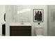 Modern bathroom featuring a dark vanity with a white countertop and silver faucet and a black and white wall art piece at 4571 E French Rd, San Tan Valley, AZ 85143