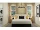 Cozy bedroom with a modern chandelier, stacked washer and dryer and stylish wallpaper at 4571 E French Rd, San Tan Valley, AZ 85143