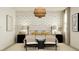 Inviting bedroom with a statement wallpaper, layered bedding, and modern decor at 4571 E French Rd, San Tan Valley, AZ 85143