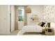 Cozy bedroom featuring a comfortable bed, neutral décor, and soft natural light from the nearby window at 4571 E French Rd, San Tan Valley, AZ 85143