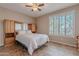Inviting bedroom with built-in cabinetry, cozy bed, and bright window at 5077 E Lonesome Trl, Cave Creek, AZ 85331