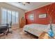 Comfortable bedroom with vibrant walls, ample desk space, and bright windows at 5077 E Lonesome Trl, Cave Creek, AZ 85331