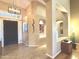 The bright and inviting entryway features tile floors and views into the living spaces at 5077 E Lonesome Trl, Cave Creek, AZ 85331