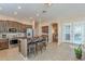 Open kitchen featuring a center island with seating, stainless steel appliances, and custom wood cabinetry at 5077 E Lonesome Trl, Cave Creek, AZ 85331