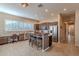 Well-lit kitchen with stainless steel appliances, a center island, and a breakfast bar for casual dining at 5077 E Lonesome Trl, Cave Creek, AZ 85331