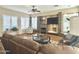 Cozy living room with fireplace, stone accents, and comfortable seating at 5077 E Lonesome Trl, Cave Creek, AZ 85331