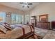 Serene main bedroom with vaulted ceilings, neutral tones, and a dresser with a large mirror at 5077 E Lonesome Trl, Cave Creek, AZ 85331