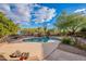 Inviting backyard pool with desert landscaping, a spa, and ample space for outdoor entertaining at 5077 E Lonesome Trl, Cave Creek, AZ 85331