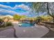 Backyard pool with hot tub and desert landscaping, offering a private retreat at 5077 E Lonesome Trl, Cave Creek, AZ 85331