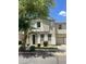 Two-story home featuring a stucco exterior, a stone-accented entrance, and an attached one-car garage at 6614 W Polk St, Phoenix, AZ 85043