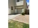 Home exterior features a gray stucco finish, a two-car garage, and a well-maintained driveway at 6614 W Polk St, Phoenix, AZ 85043