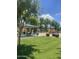 Community playground featuring a picnic shelter, green grass, and colorful play equipment at 6614 W Polk St, Phoenix, AZ 85043