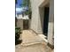 Side yard with brick pavers, mature landscaping, and a gate leading to the backyard at 6614 W Polk St, Phoenix, AZ 85043