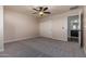 Large empty bedroom features a ceiling fan and closet doors; a blank canvas ready for personal touches at 6632 W Saguaro Park Ln, Glendale, AZ 85310