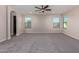 A spacious bedroom has neutral walls, recessed lights and large windows at 6632 W Saguaro Park Ln, Glendale, AZ 85310
