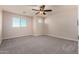 Bright bedroom featuring a ceiling fan and two windows offering plenty of natural light at 6632 W Saguaro Park Ln, Glendale, AZ 85310