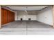 Spacious two-car garage featuring built in cabinets for storage and organized functionality at 6632 W Saguaro Park Ln, Glendale, AZ 85310