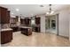 Gourmet kitchen features custom cabinetry, granite countertops, tile backsplash, and stainless appliances at 6632 W Saguaro Park Ln, Glendale, AZ 85310