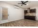 A versatile living room and kitchenette with modern finishes and fixtures at 6632 W Saguaro Park Ln, Glendale, AZ 85310