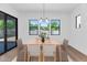 Dining room showcasing a table set with views to the backyard and neutral decor at 6722 N 9Th Dr, Phoenix, AZ 85013
