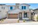 Stunning two-story home boasts a modern design, desert landscaping, and a stylish garage door at 6722 N 9Th Dr, Phoenix, AZ 85013